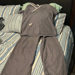 Extra small scrub set by Urban scrubs grey with light pink trim at the neck.